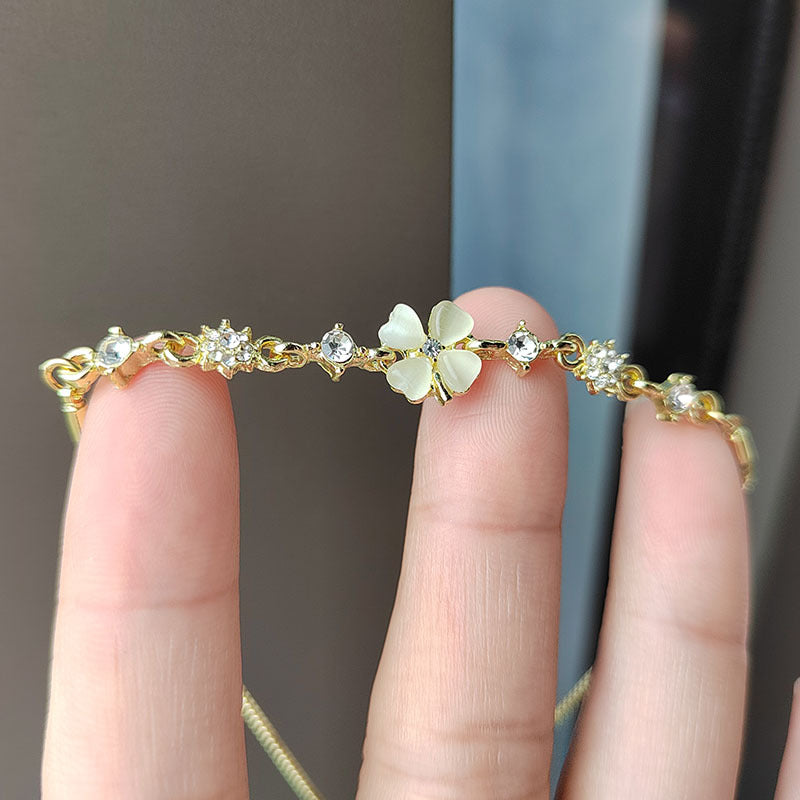 Wholesale Real gold electroplated diamond cat's eye stone high-end temperament petal flower hand jewelry